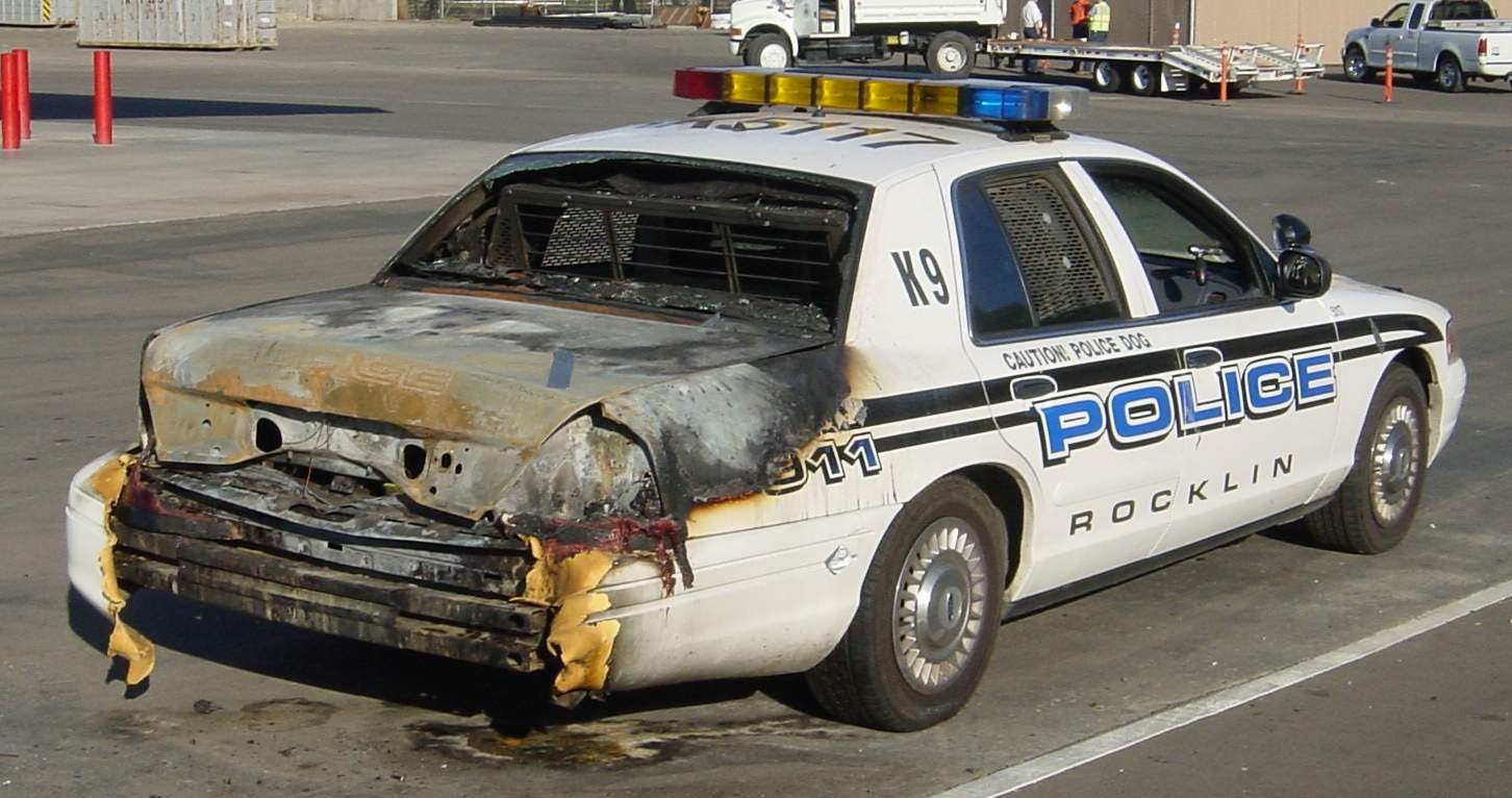 Police car burned from accidental ignition of old-fashioned flare